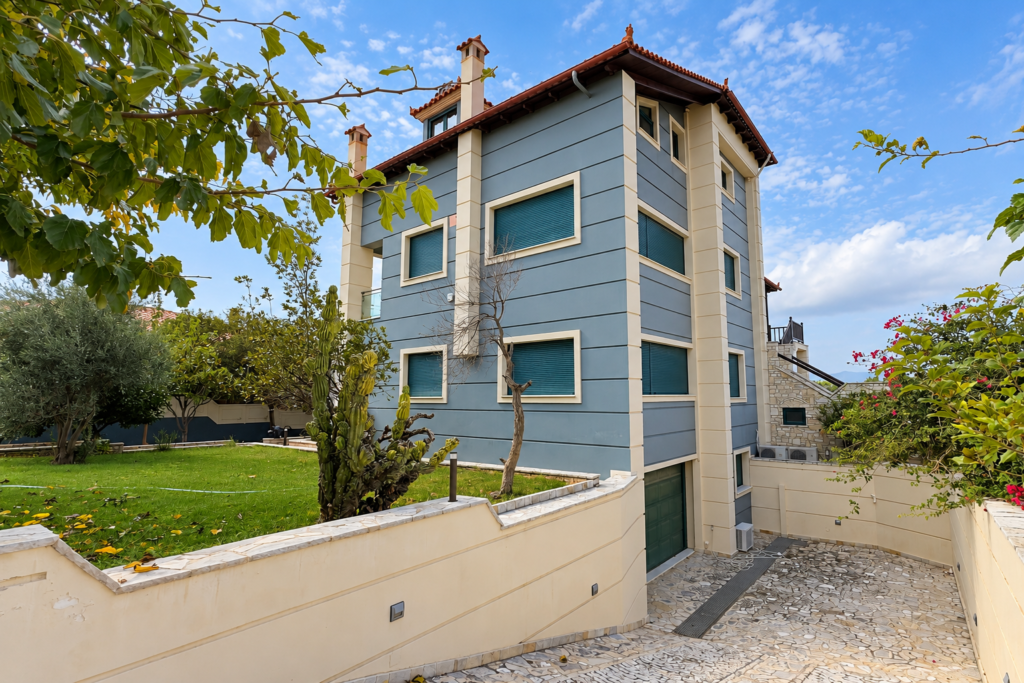 Exterior of a Four-Level Smart Home Side view of the residence with balconies and garden