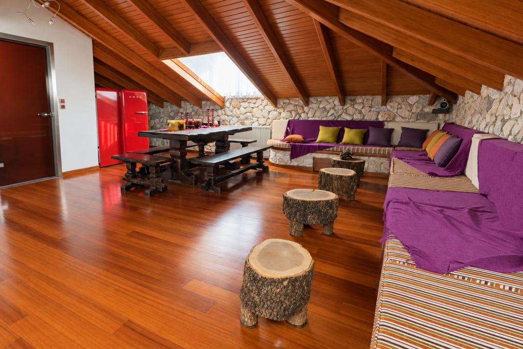 Smart Home Loft Loft living area with timber ceiling and stone walls